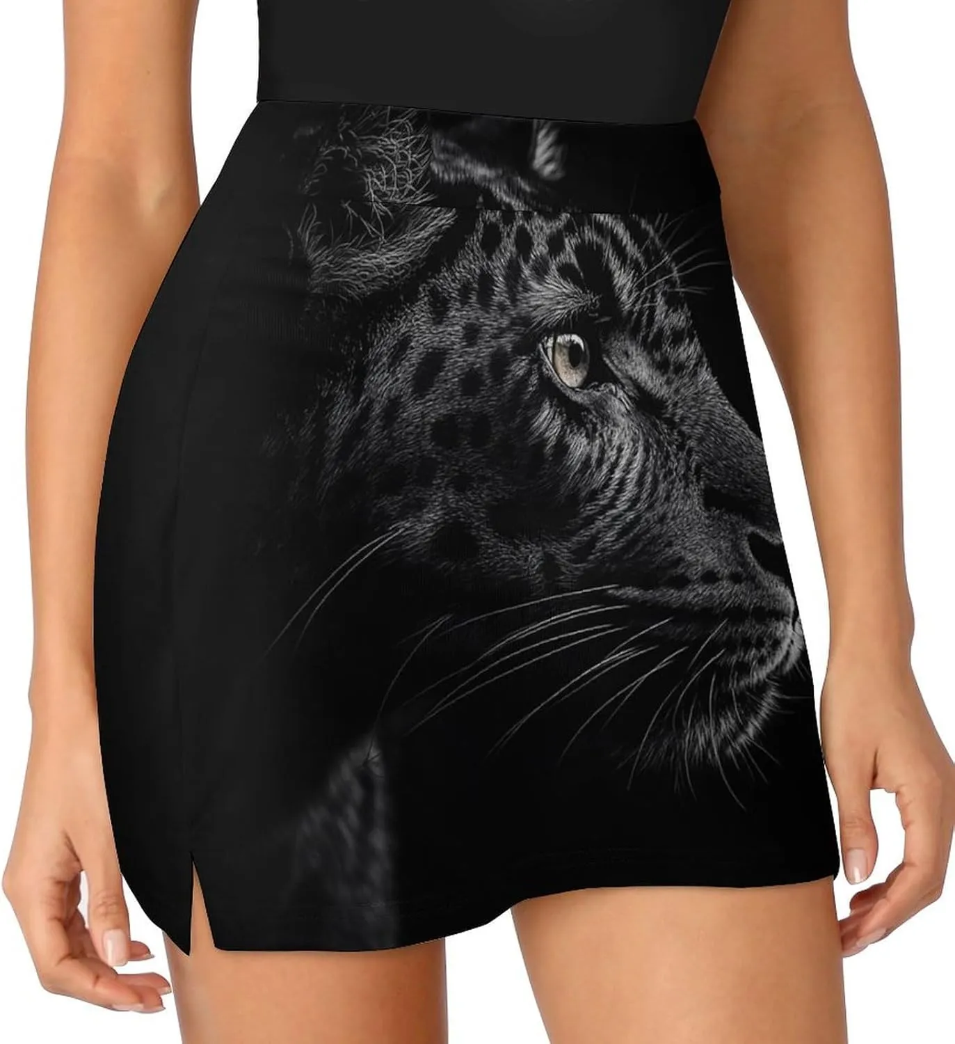Close-up of Black Leopard Women's Mini Tennis Skirt with Shorts Underneath Athletic Workout Cute Skorts